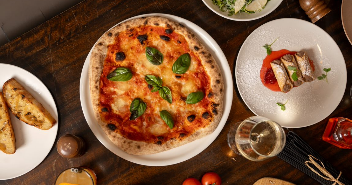 Wood-fired pizza with fresh ingredients at Il Posto, Paddington – the perfect dish for any festive celebration.